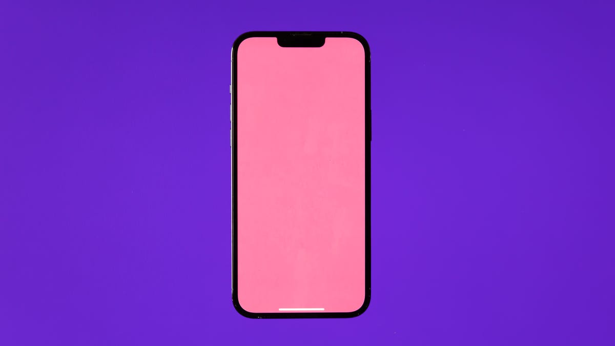 Apple iPhone 13 Pro with pink screen, purple background