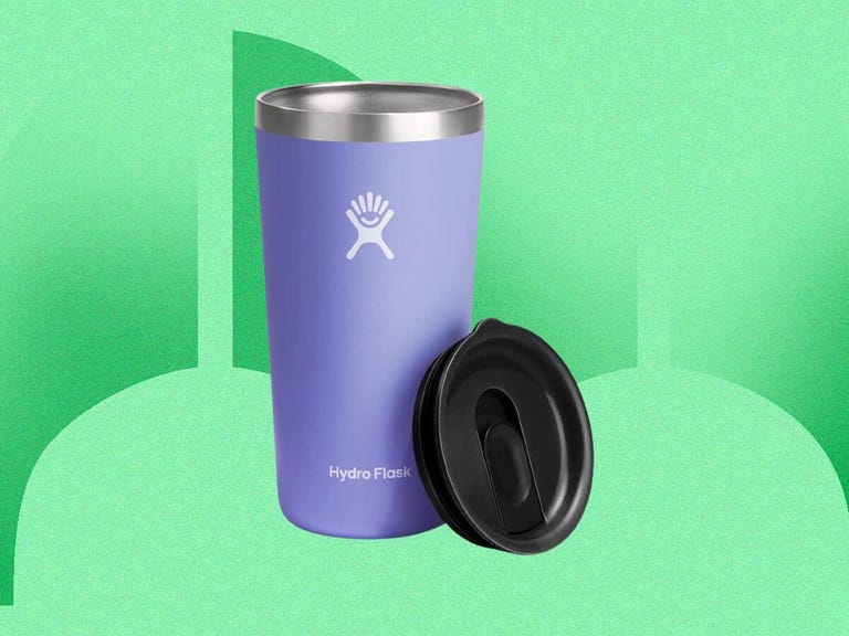 Blue tumbler on a green background