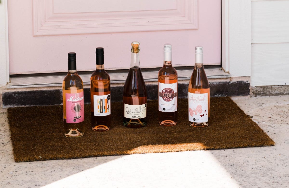 five bottles of rose wine on the doorstep