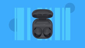 A pair of black Samsung earbuds in their charging case against a blue background.