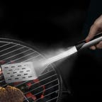 barbecue spatula with flashlight attached to handle