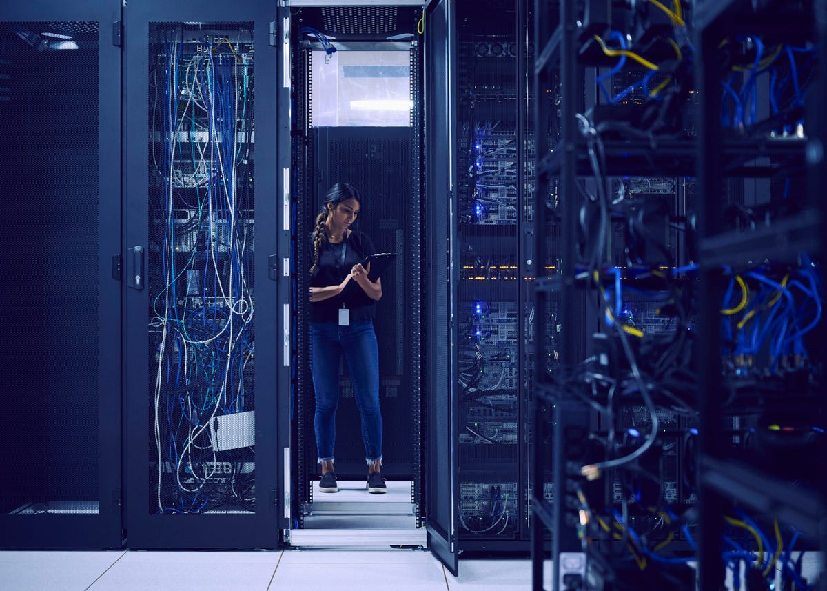 Image of a person working in a server room