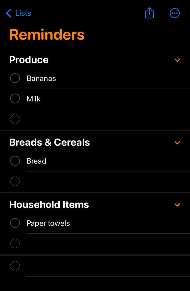 Reminders app on iOS set to create a grocery list. Sections include breads and cereals, produce and household items