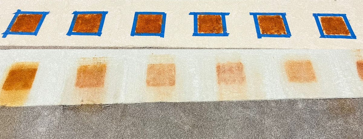 A before-and-after shot showcases the results of CNET's tough mess test for carpet cleaning machines, where each cleaner does its best to clean marinara sauce off of a white carpet. None of the cleaners we tested removed the stain outright, but some were a lot better than others.