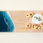 Maple cutting board with cheese and bread