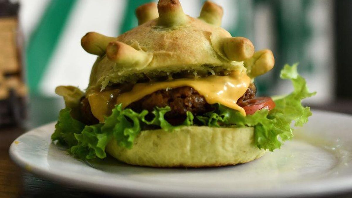 A novelty hamburger with a bun that looks like the coronavirus