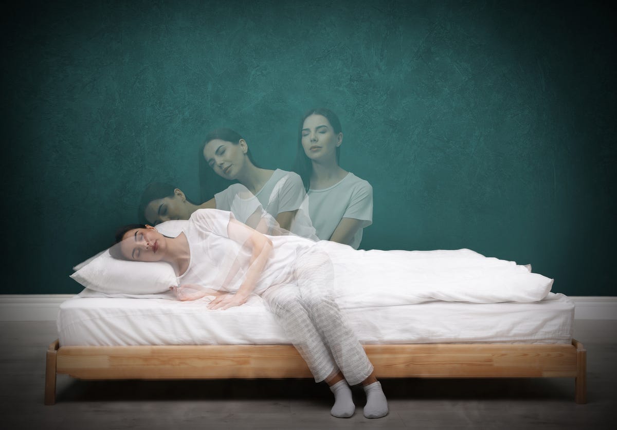 Multiple exposure of woman getting up from the bed sleepwalking