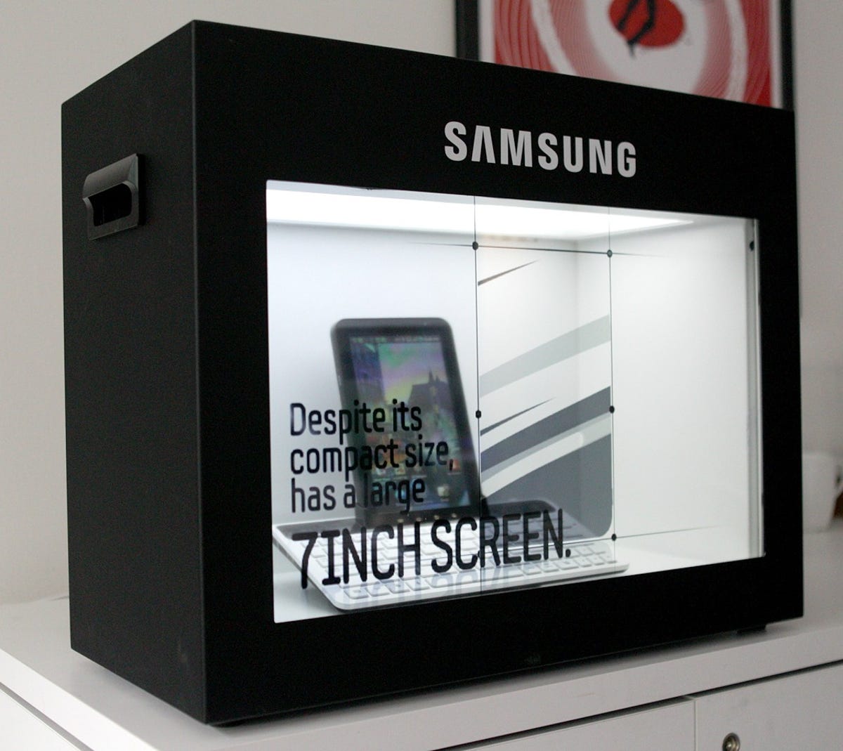 Samsung Galaxy Tab behind transparent display