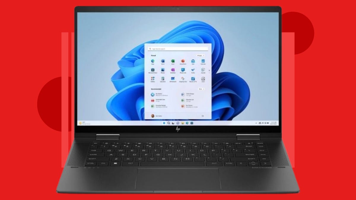 HP Envy 2-in-1 touchscreen laptop against red background