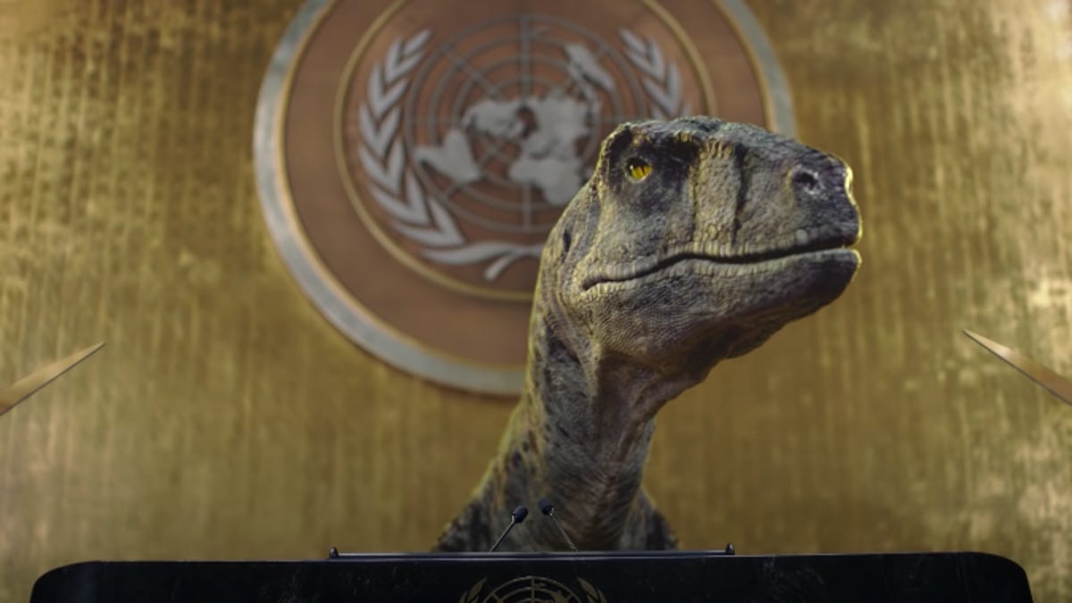 CGI dinosaur speaks at the podium in a UN video