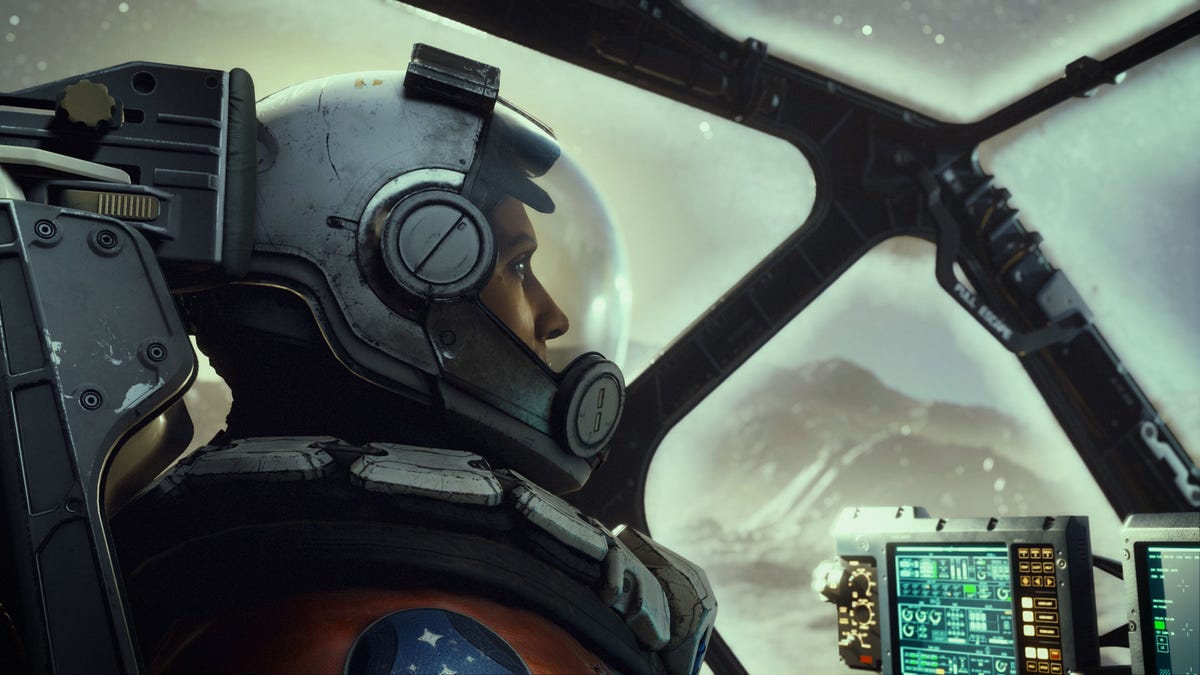 A Starfield character in a cockpit and wearing a flight helmet
