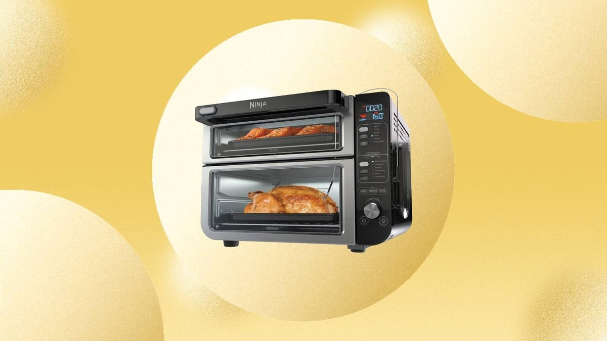 The Ninja Foodi 12-in-1 Smart Double Oven is displayed against a yellow background.