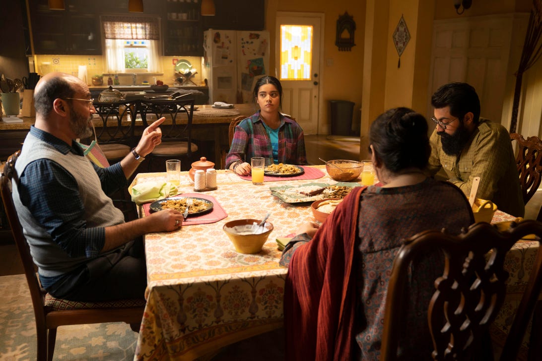 The Khan family converse around the kitchen table in Ms. Marvel