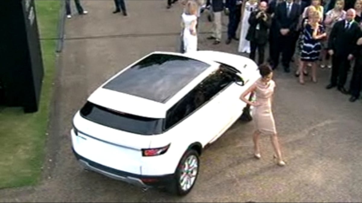 Victoria Beckham poses with the Range Rover Evoque.