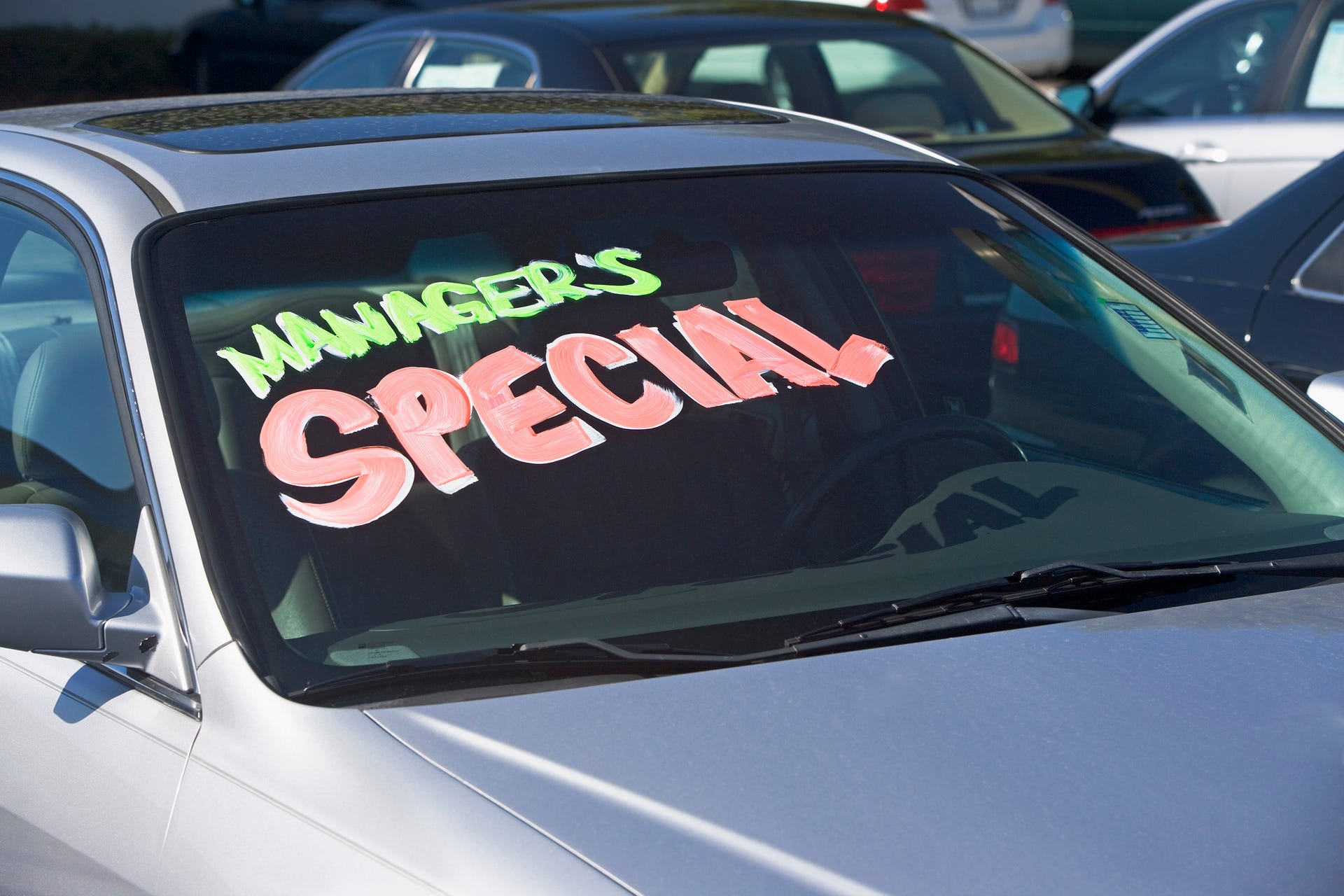 Used car with Manager's Special written on the windshield