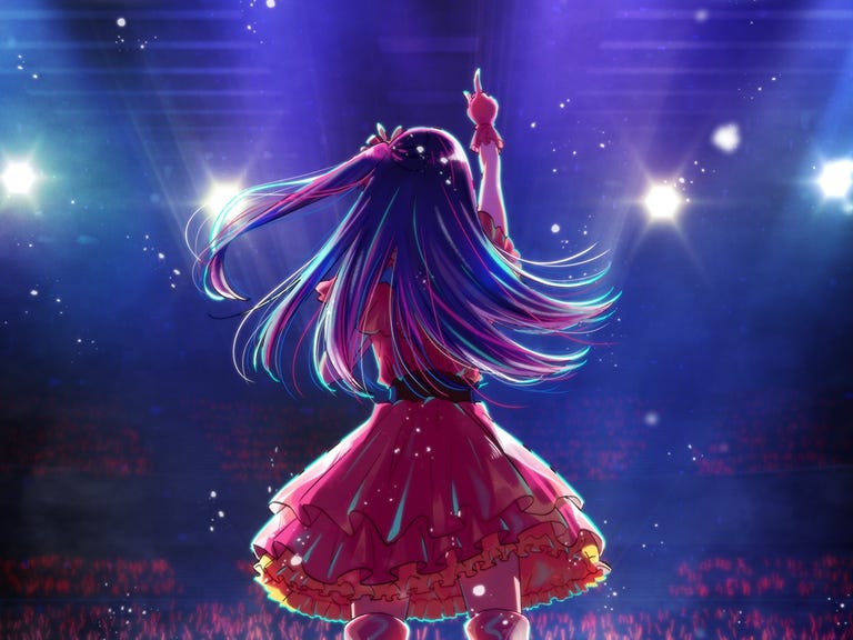animated singer stands on stage facing the crowd