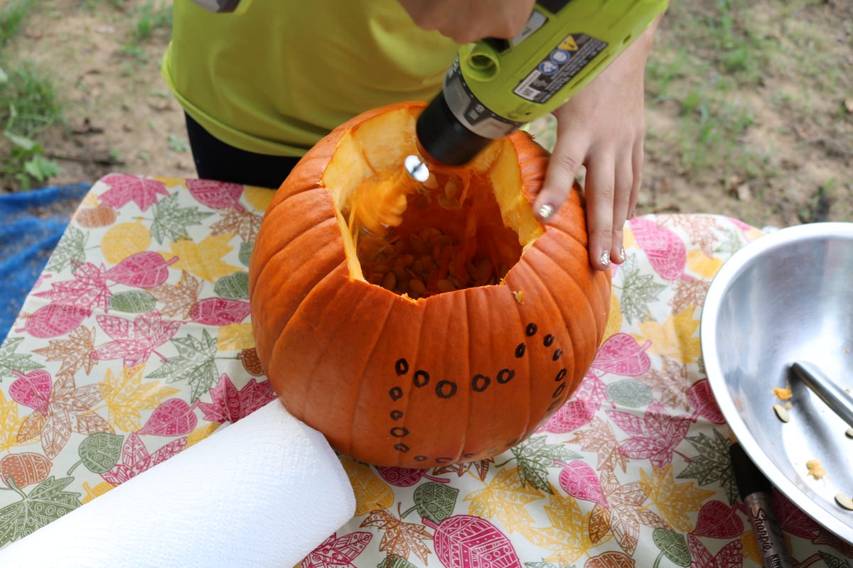 Scrape the inside of the pumpkin