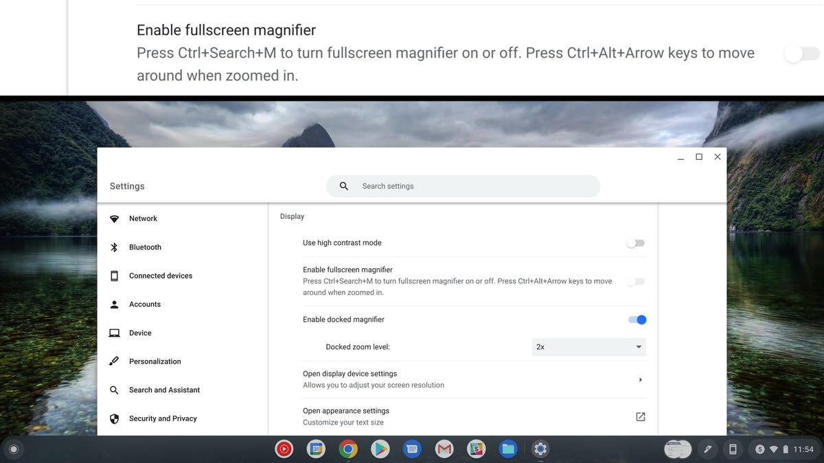 Chrome OS docked magnifier accessibility feature can be turned on in the Manage Accessibility Features section of the Settings panel. The split screen view can be adjusted by dragging the horizontal divider up and down.