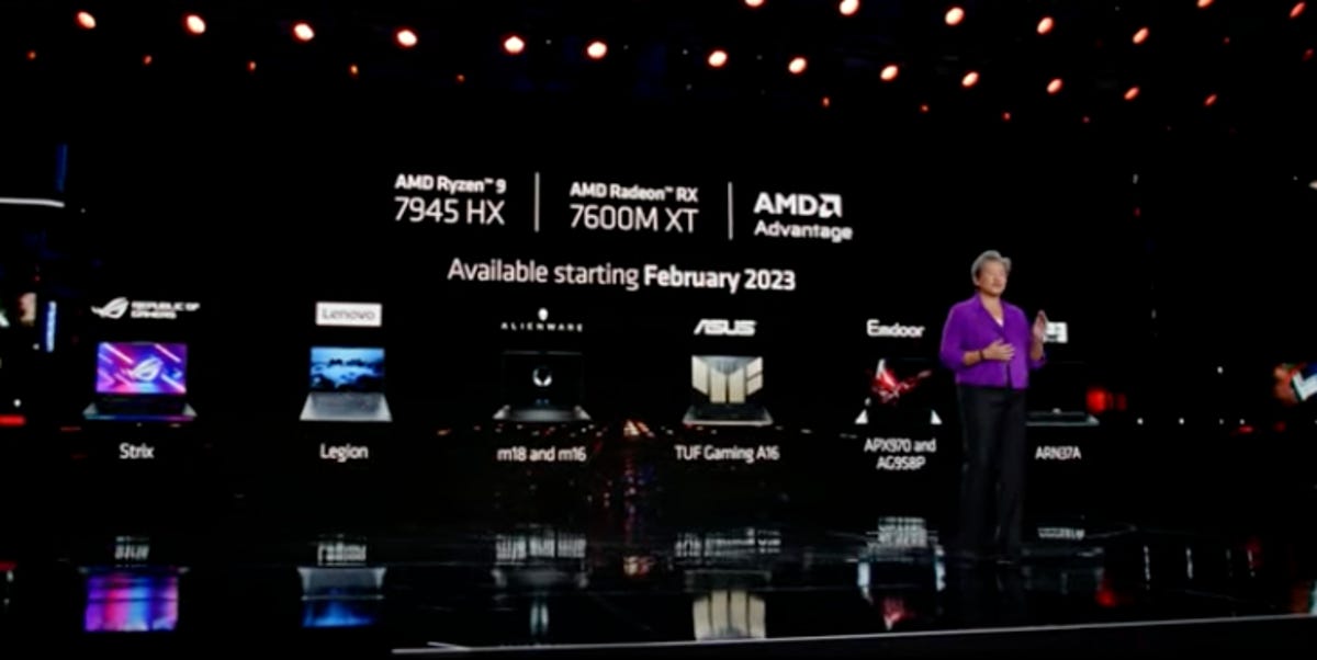 AMD CEO Dr. Lisa Su stands in front of a slide with its lineup of Ryzen processors.