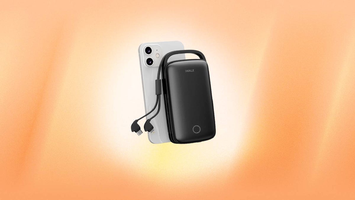 A black portable charger and an iPhone against an orange background.