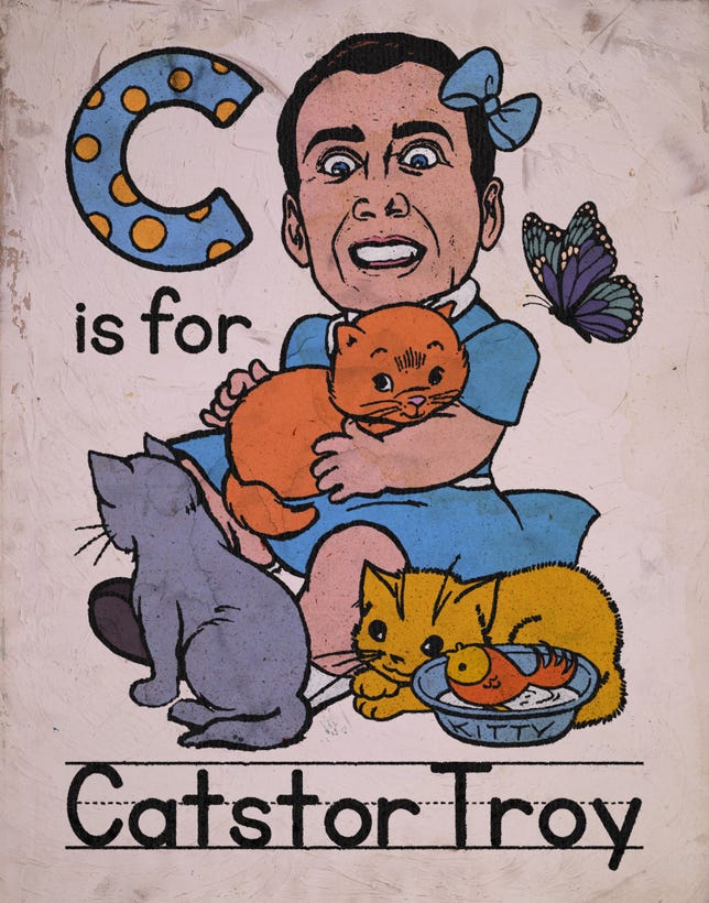 Catstor Troy, iri gözlü bir Nic Cage ve üç karikatürize kediyi gösteren bir baskı kağıdıdır.