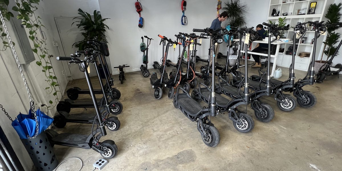 Scooters lined up in the FluidFreeRide Miami showroom