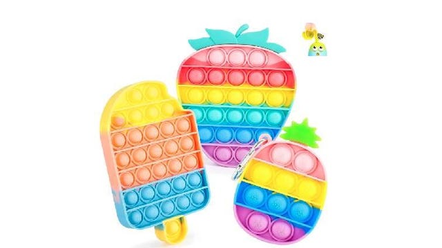 A collection of Pop It fidget toys -- popsicle, strawberry and pineapple.