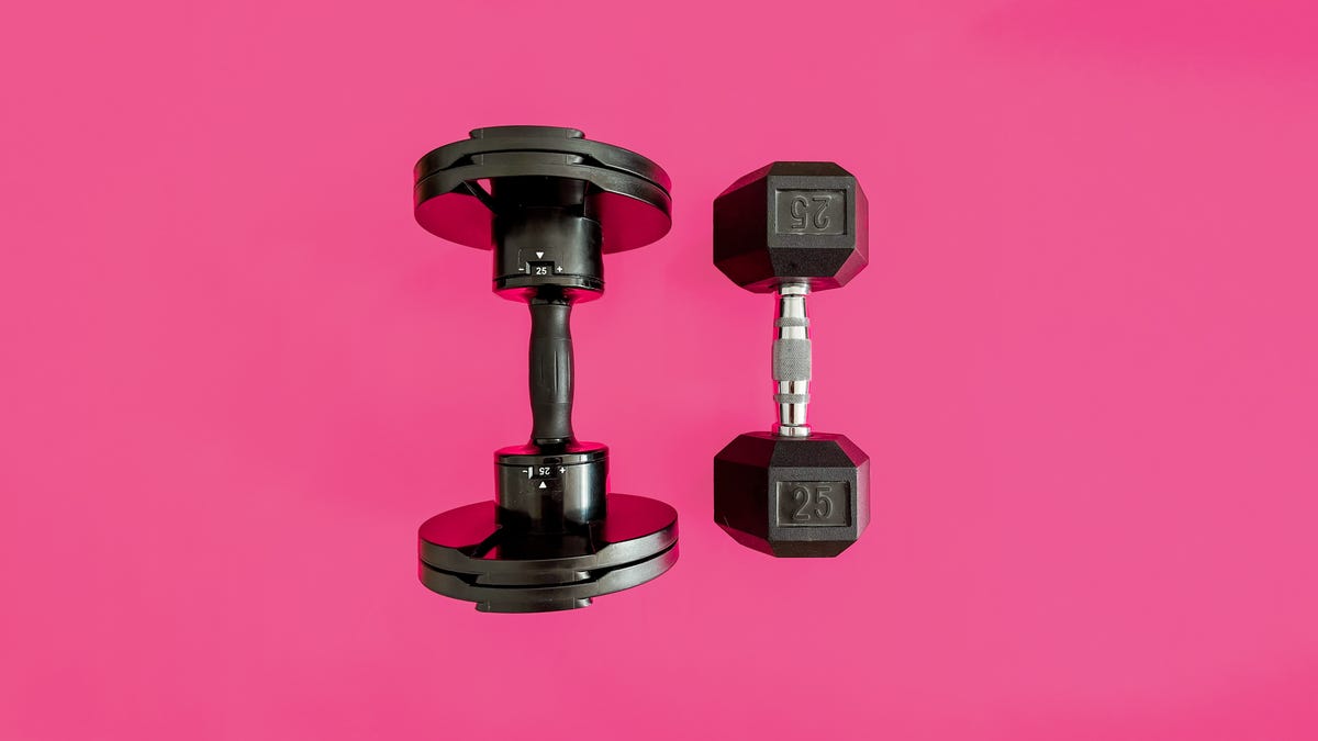 Adjustable dumbbell next to a traditional dumbbell