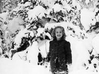 <p>My mother, posing for a photo in the snow.</p>