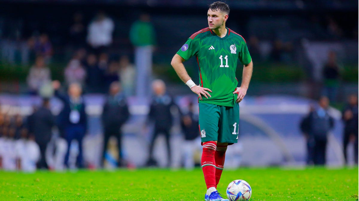 Santiago Gimenez of Mexico standing with the ball at his feet looking sideways to his right.