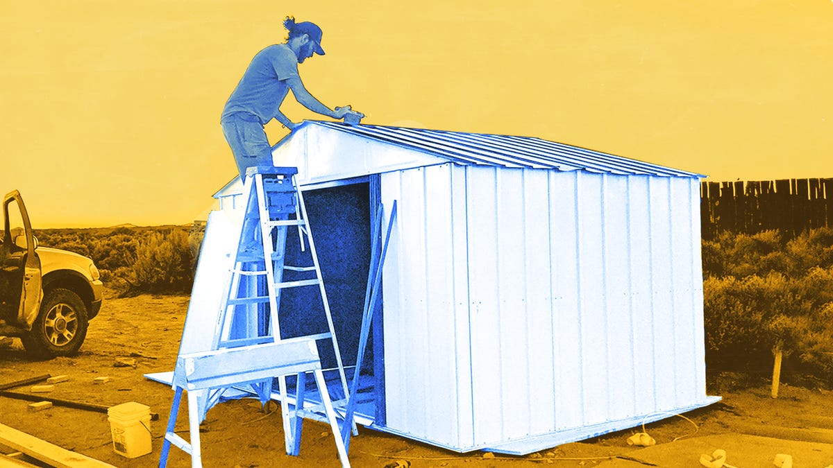 Eric Mack assembling a storage shed off-grid