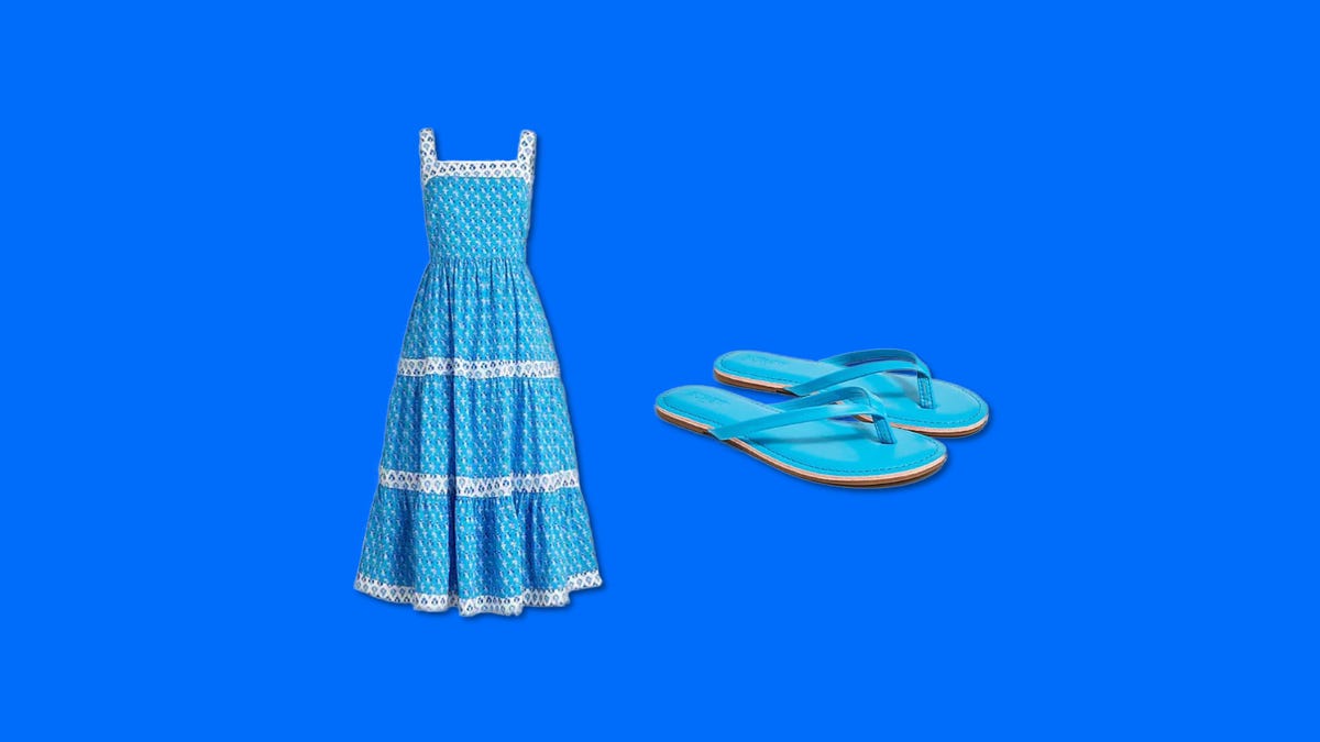 A blue dress and blue sandals placed side by side