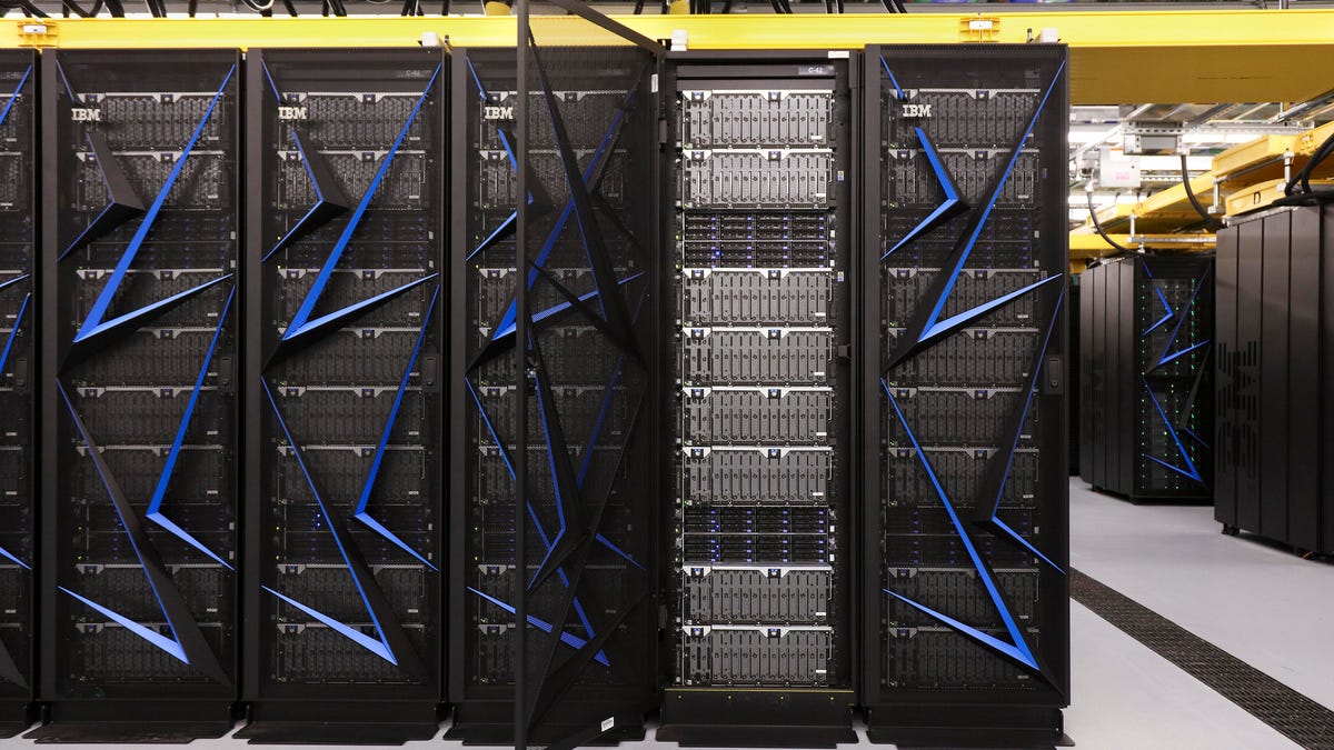 Some of the racks of computer nodes that make up the Summit supercomputer built by IBM at Oak Ridge National Laboratory in Tennessee.