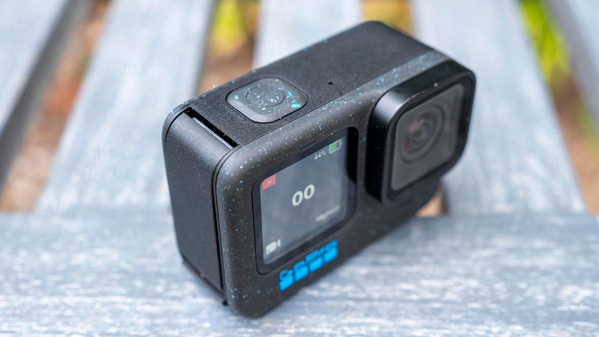 GoPro Hero12 Black three-quarter view of the top showing the new black with blue speckles body color treatment.