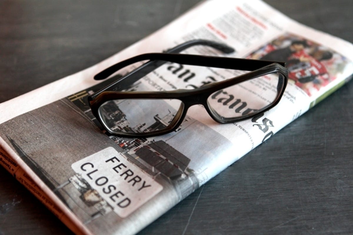 eyeglasses on newspaper