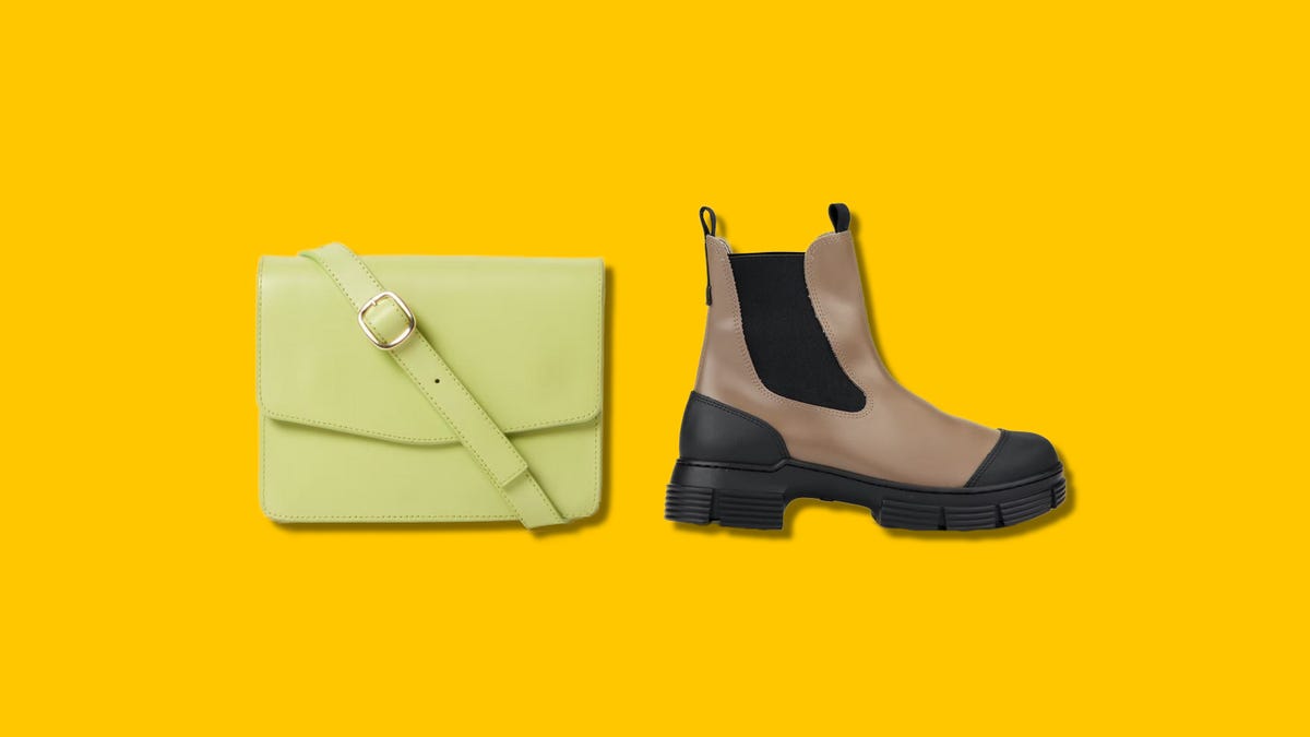 A green purse and a brown boot next to each other on a yellow background