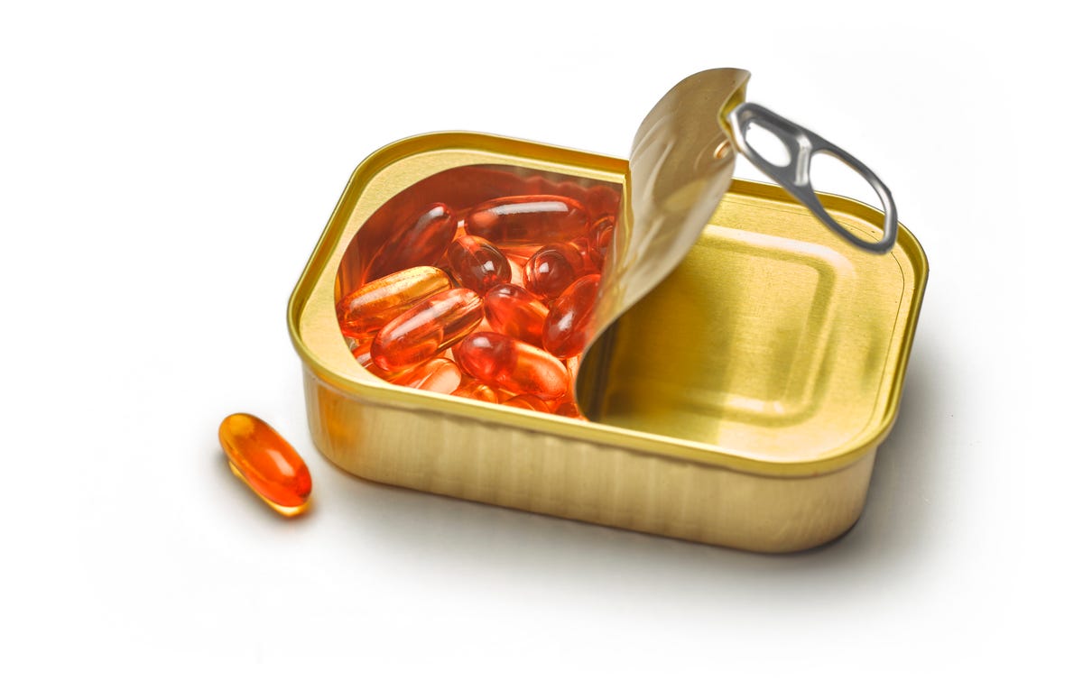 Omega 3 capsules in a box of sardines