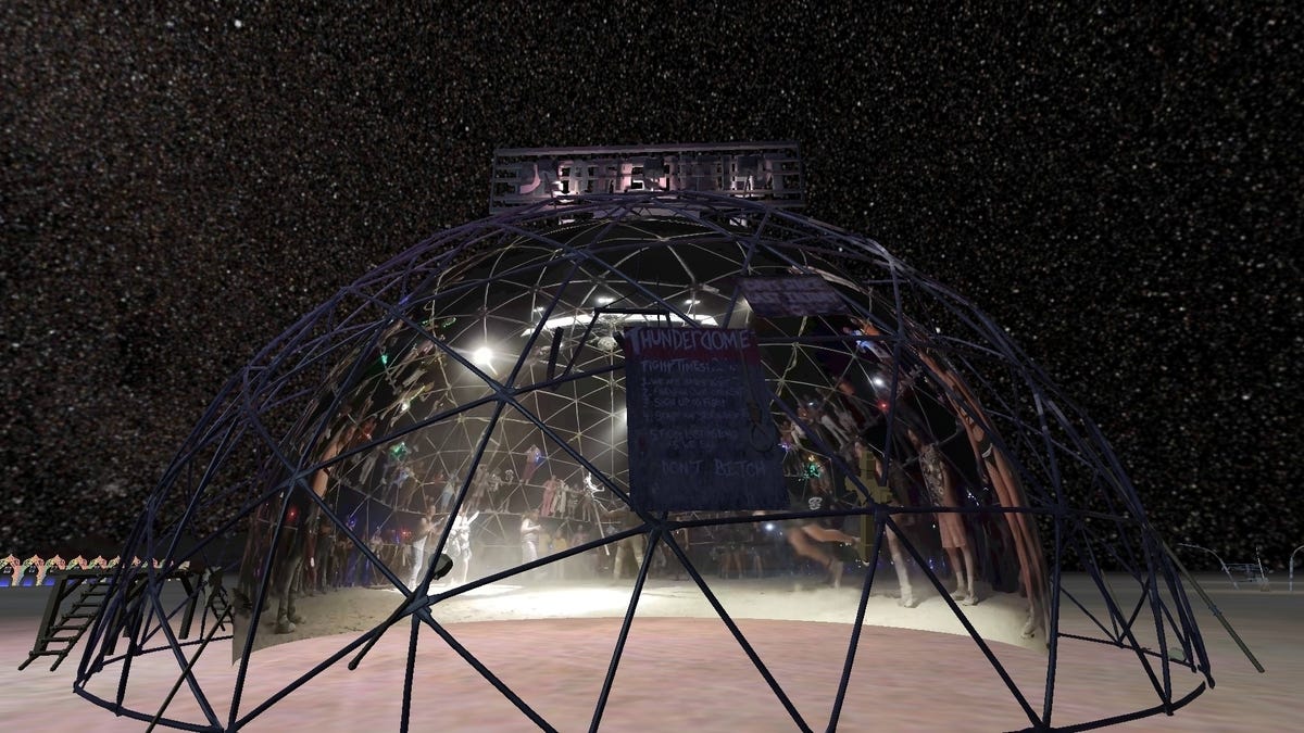 A metal scaffolding dome at night in VR features 360-degree video of the people inside.