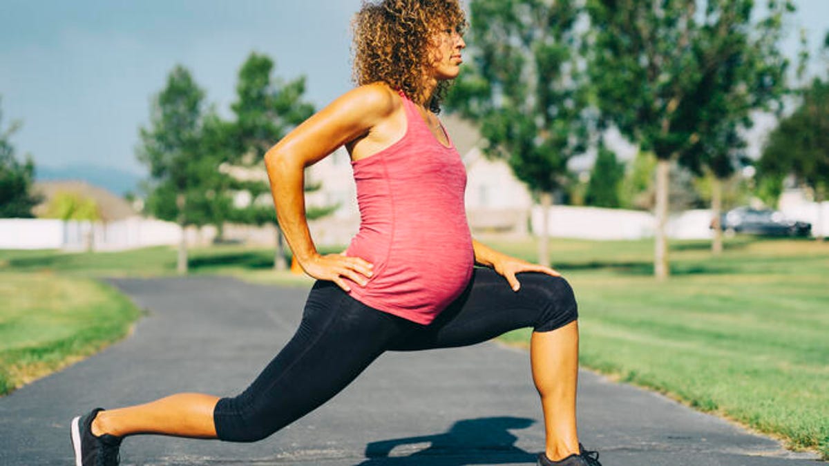 pregnant woman reverse lunging