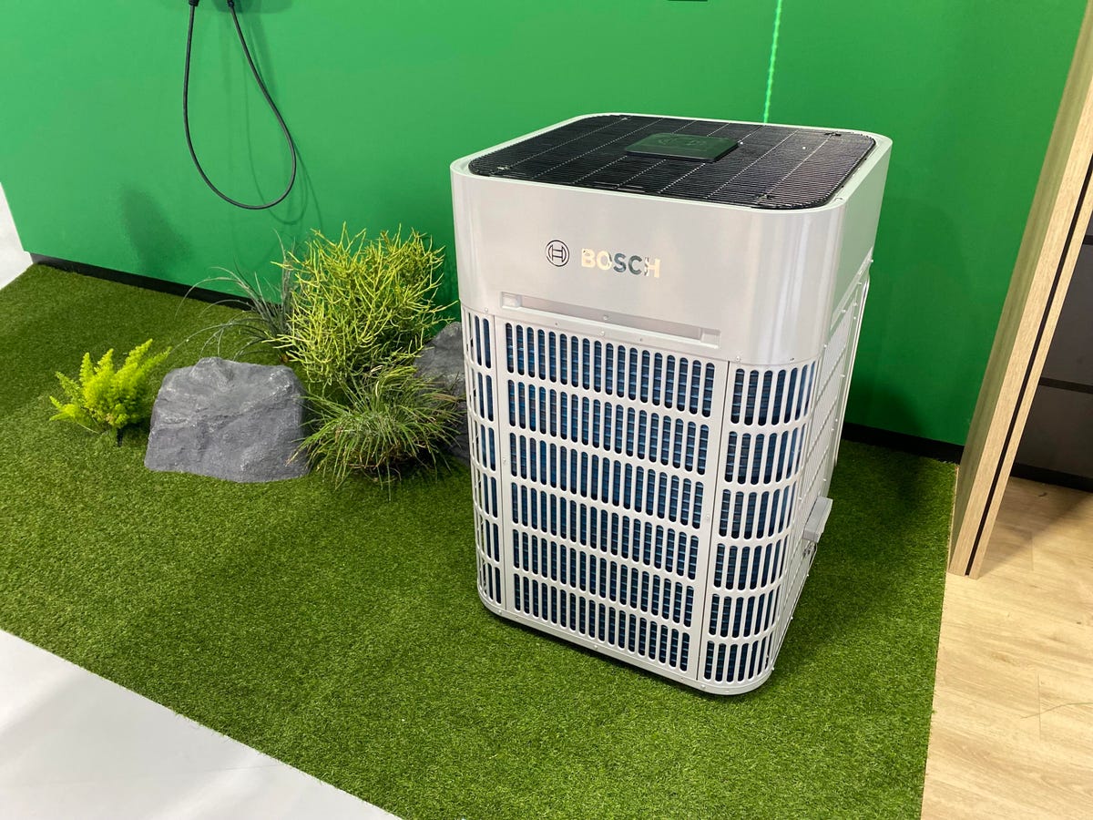 A Bosch heat pump sitting in a display at a booth at CES 2024.
