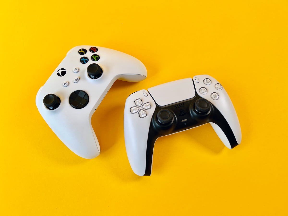 White Xbox and PS5 controllers.