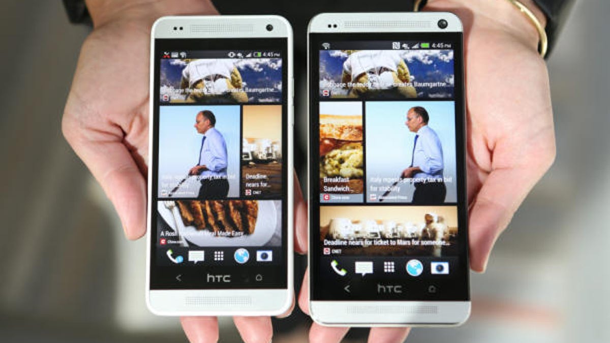 The HTC One (right) and its baby brother, the HTC One Mini.