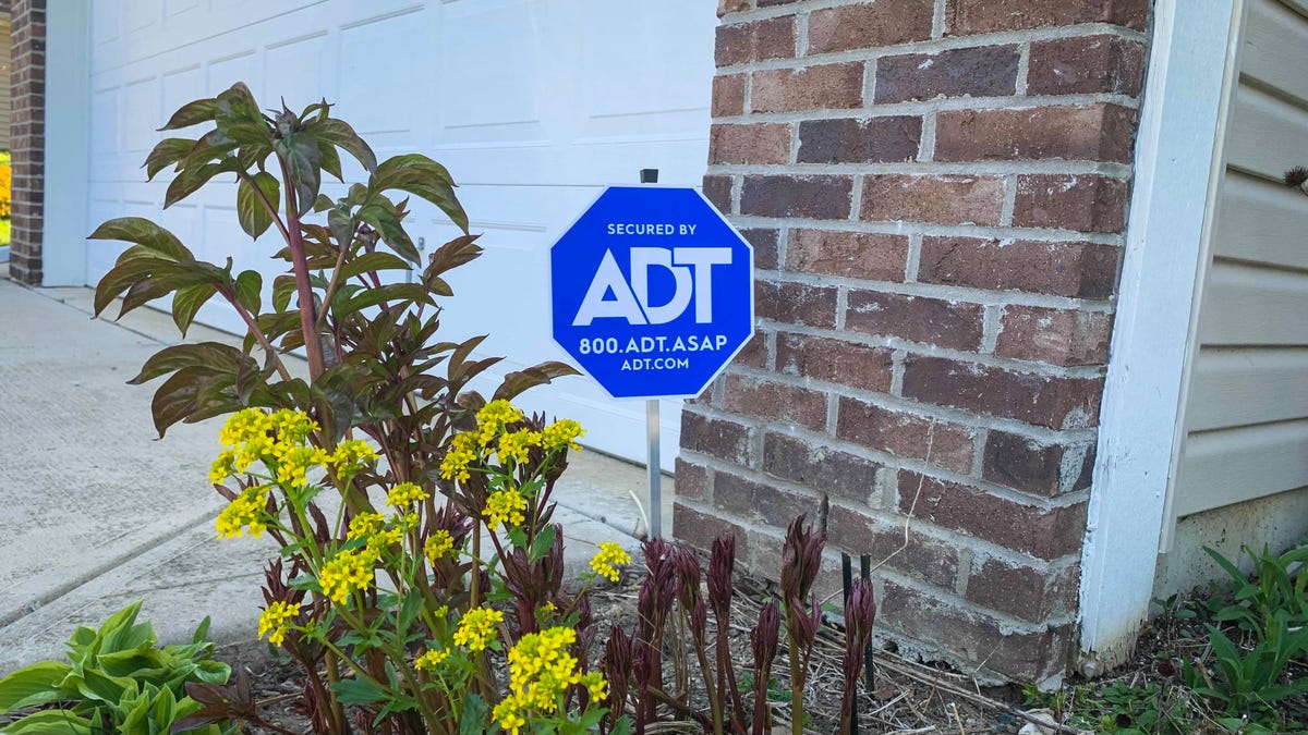 ADT sign in front of a house