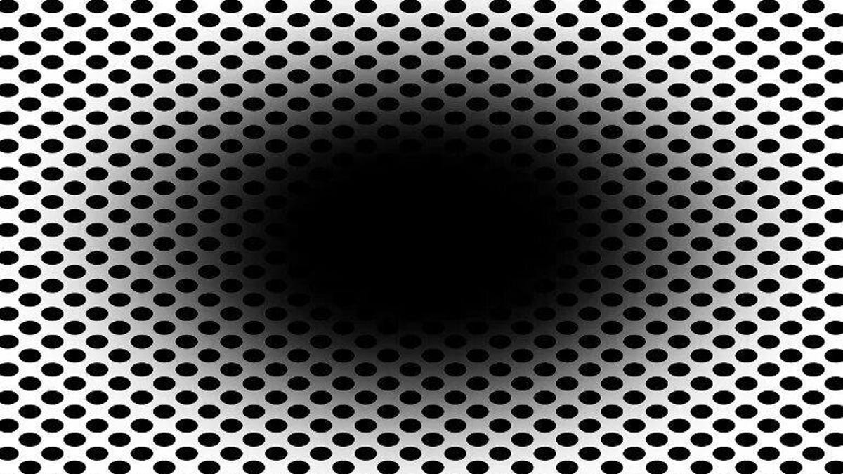 An "expanding" black hole surrounded by small dots.