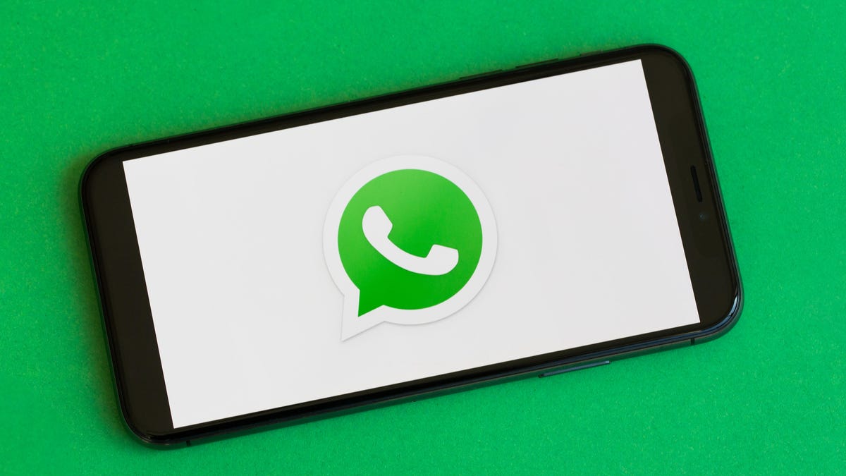 WhatsApp logo on a phone screen