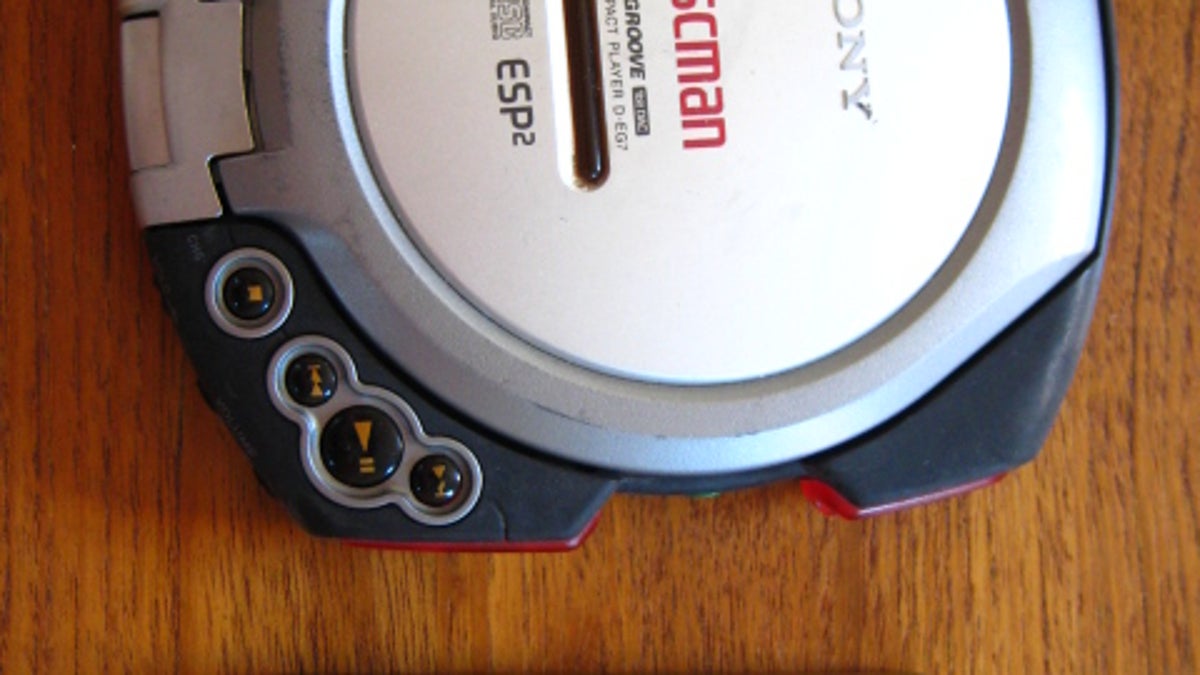 Photo of Sony Discman CD player next to Microsoft Zune 80 MP3 player.