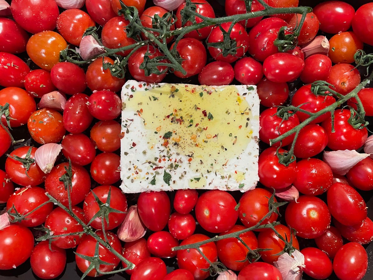 Feta cheese, cherry tomatoes, herbs and oil