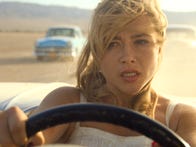 <p>Florence Pugh drives across a desert in the movie Don't Worry Darling.</p>