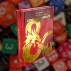 A red book with the D&D ampersand in gold on the front