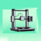 An Anker 3D printer against a green background.